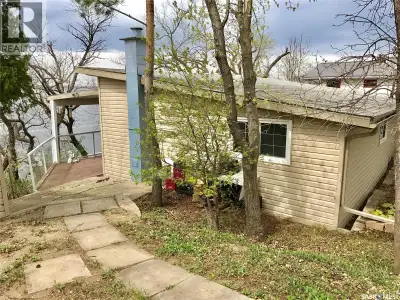 This waterfront retreat offers a rare opportunity with its flexible lot configuration. The main cott...