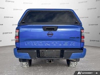 Awarded a 2024 IIHS Top Safety Pick, this striking blue 2024 Nissan Frontier Crew Cab Pickup excels... (image 5)