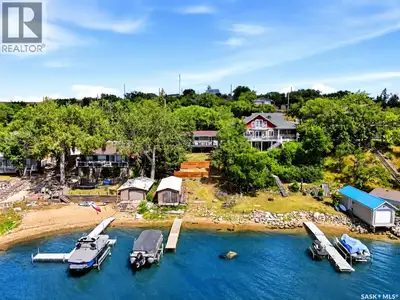 Welcome to 61 Pelican Drive in Pelican Pointe—an extensively updated waterfront bungalow offering be...