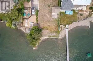 Rare opportunity to own one of the last vacant lots on Okanagan Lake with Multi Family Zoning . This...