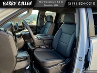 The 2026 Chevrolet Silverado 2500HD Work Truck in pristine white and equipped with a rugged 4x4 driv... (image 4)