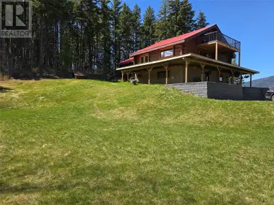 PRIVATE 4,500 sq. ft, YOUR NEW 4 bedroom log home Boasts a huge wrap around deck, large detached dou...