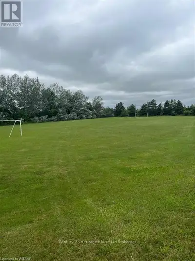 This land is the soccer field adjacent to the Colombo Club in Beachville. The Seller will sever and...