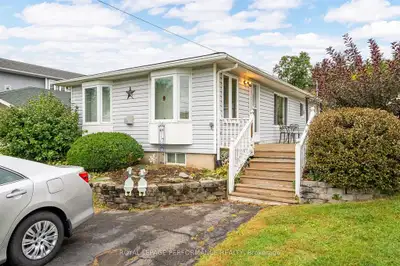 Cozy bungalow with waterfront and municipal services! This quaint, well maintained two bedroom home...