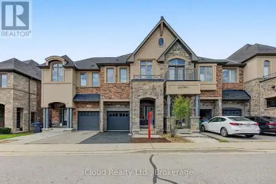 OVER 2000 SQFT ABOVE GRADE This Stone & Brick Elevation 4 Br & 3 Wr Townhouse In A Very Desirable Lo...