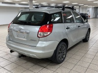 Silver light glances off the Titanium Metallic paint as it moves, the compact hatchback shape cuttin... (image 5)