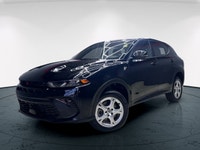 Introducing the 2024 Dodge Hornet GT AWD, a dynamic SUV that commands attention with its black-on-bl... (image 1)