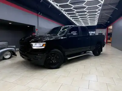 The 2019 Ram 1500 Sport 4x4 Quad Cab in a majestic black on black configuration exemplifies power, s...