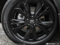 The 2025 Black Honda CR-V Hybrid Touring AWD is your gateway to balanced power and superior handling... (image 6)