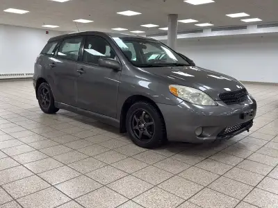 With 254,988 kilometers behind it, this 2006 Toyota Matrix XR has already proven the kind of durabil...