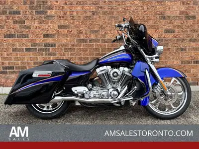 WOW! This CVO Electra Glide is all customized with chrome wheels, Rinehart Racing pipes, stretched b...