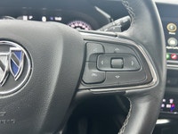 The 2023 Buick Envision Essence, presented in a sophisticated Gray finish, masterfully blends luxuri... (image 9)