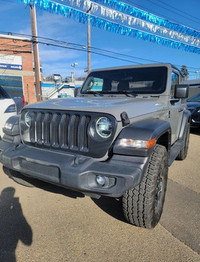This Jeep Wrangler Sport boasts a Intercooled Turbo Premium Unleaded I-4 2.0 L/122 engine powering t... (image 1)