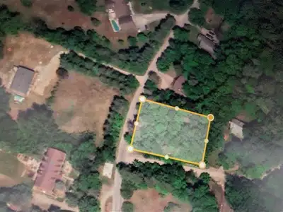 Discover this pristine building lot at the corner of Rockhurst and Pine Ridge in charming Wakefield....