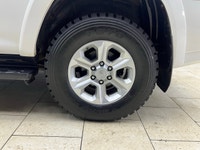 The 2015 Toyota 4Runner 4WD 4dr V6 SR5, in its striking White exterior paired with a robust 44 drive... (image 3)