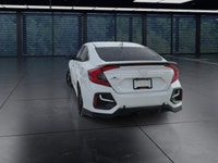 The 2020 Honda Civic Si Sedan in white offers a dynamic driving experience with its FWD drivetrain a... (image 6)