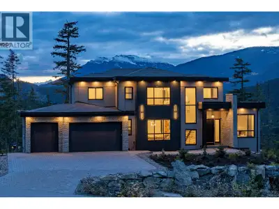 A striking luxury retreat in WedgeWoods, 9289 Stellar's Way pairs contemporary mountain architecture...