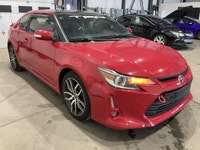Le Scion tC 2016 usagé proposé par AutoStudio 72 à Mirabel mise sur une conduite engageante avec sa... (image 4)