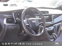 The 2025 Cadillac XT6 AWD Sport, dressed in a sophisticated Stellar Black Metallic exterior and a lu... (image 8)