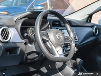The former daily rental 2024 Nissan Versa SV, dressed in an eye-catching Aspen White TriCoat, presen... (image 5)