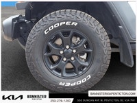 The 2022 Jeep Wrangler Unlimited Willys 4x4 in a classic white exterior and rugged 44 drivetrain is... (image 6)
