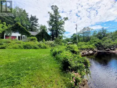 Charming Gothic Revival Home on 4 Acres with Approx 1500 Feet of Waterfront. Step into history and t...