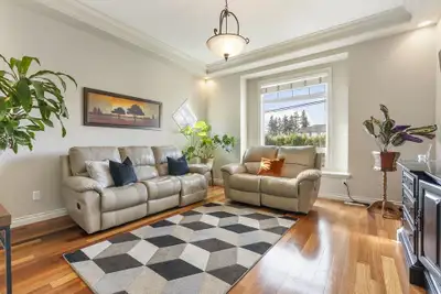 Elegant 6BR 3.5BTH Fleetwood corner residence. Gleaming floors flow throughout your stunning, open m...