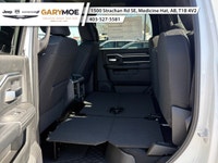 Introducing the 2026 Ram 2500 Big Horn 4x4 Crew Cab with a 64 Box in a vibrant white exterior paired... (image 8)
