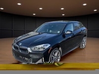 The 2022 BMW X2 xDrive28i Sports Activity Coupe in a sophisticated black finish and equipped with BM... (image 1)