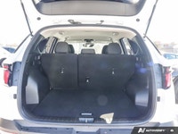 The 2023 Hyundai Tucson Preferred, featuring a brilliant Crystal White exterior complemented by a re... (image 6)