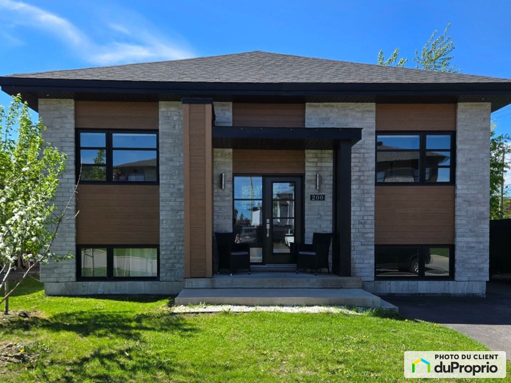 $590,000 - Bungalow for sale in St-Lin-Laurentides — photo 1