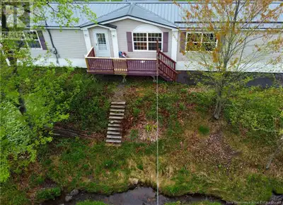 Beautiful country setting! This home is nestled away beyond the trees with a babbling brook that mak...