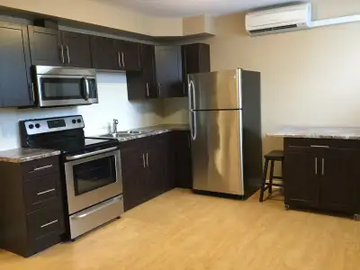Lovely 1BR main floor $1850. INCLUSIVE WITH A/C, open concept living/kitchen/dining with large windo...
