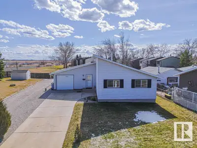 Charming bungalow in Wetaskiwin with privacy, space, and updates throughout. Situated on a massive l...