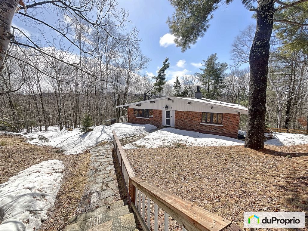 $569,000 - Bungalow for sale in Ste-Adele — photo 1