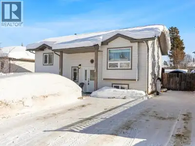 Four bedroom home with landscaped front and back yard and newer double concrete driveway. Nice size...