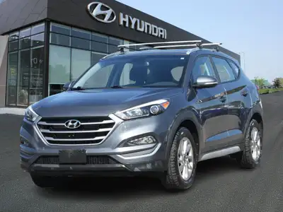 The 2018 Hyundai Tucson Premium FWD is a compact SUV that offers a perfect blend of modern design, a...