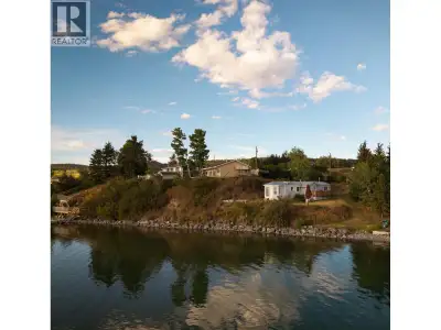 Waterfront living at scenic Lac La Hache! Welcome to this lakefront home offering 104' of beautiful...