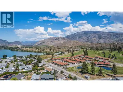 GOLFER's RETREAT! Right on the prestigious N'K Mip Desert Canyon Golf Course and offering the perfec...