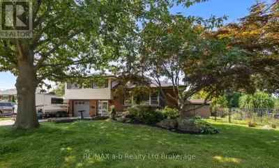 Welcome to this spacious 4-bedroom, 3-bathroom side split in one of Woodstock's most desirable north...