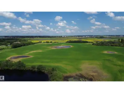 75 ACRES of farmland on the edge of the growing town of MORINVILLE! Pavement right to the edge of th...
