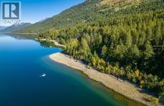 Exclusive 1.88 acre Waterfront Lot with 135 feet of your very own beach with mooring ball. Fully ser...