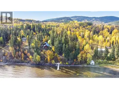 PRIME CANIM LAKE WATERFRONT! This 1.2 acre peaceful, picturesque lot has a great mix of evergreens a...