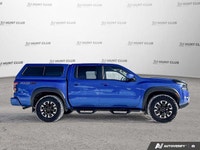 Awarded a 2024 IIHS Top Safety Pick, this striking blue 2024 Nissan Frontier Crew Cab Pickup excels... (image 7)