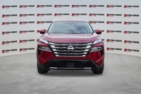 The 2025 Nissan Rogue Platinum, in striking Red, offers a sophisticated driving experience with only... (image 8)