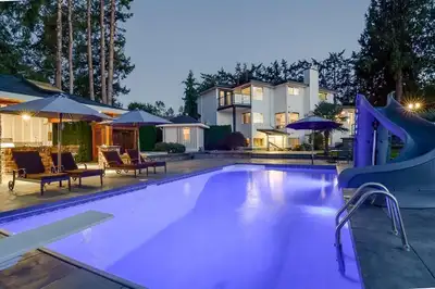 STUNNING HOME IN WEST CLAYTON SITUATED ON 1 ACRE LIVE AND DEVELOP. This property Features 7 BR + Den...