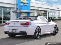 Experience the thrill of open-air driving in this stunning 2018 BMW 6 Series 650i xDrive Convertible... (image 4)
