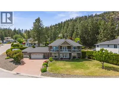 Are you looking for a beautiful home with amazing views, tons of parking, and a giant pool? This exp...