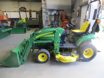 with only 980 hours; very clean well cared for tractor; with quiack attach loader and bucket and 54"...