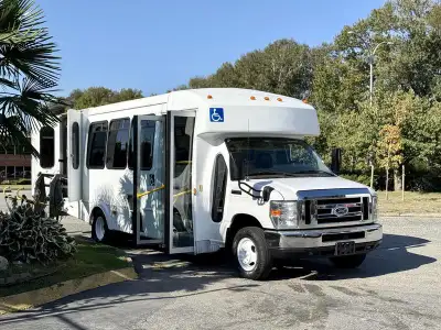 This 2015 Ford Econoline E450 Super Duty wheelchair accessible bus features a 6.8L 10-cylinder engin...